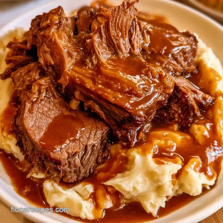 Fluffy clouds of mashed potatoes paired with succulent beef and bright orange carrots on a ceramic platter.